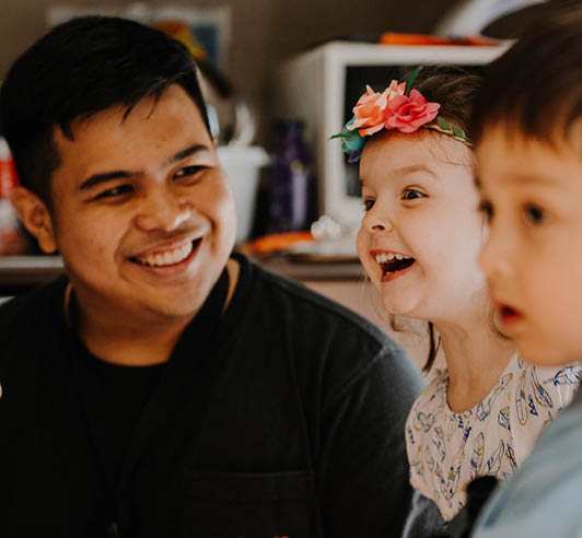 little girl smiling sitting in a child care