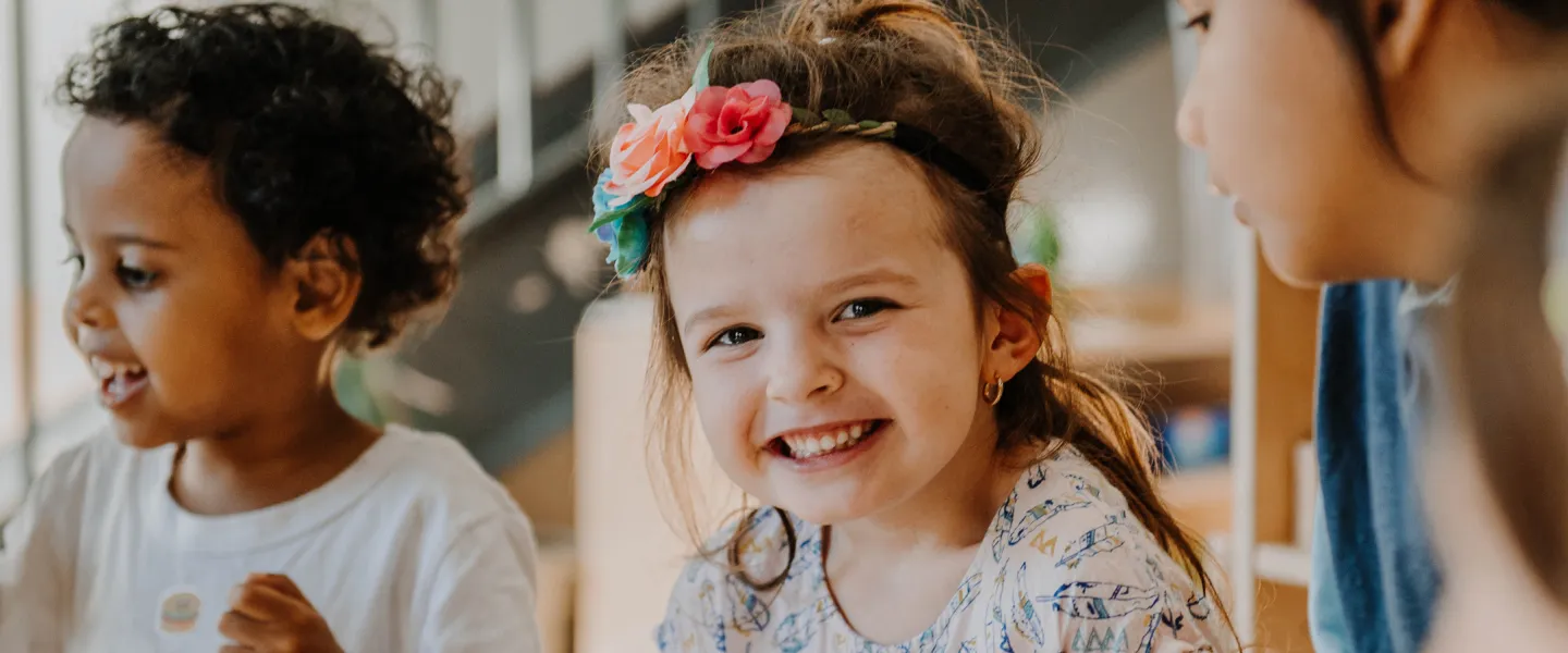 Young girl smiling in child care setting