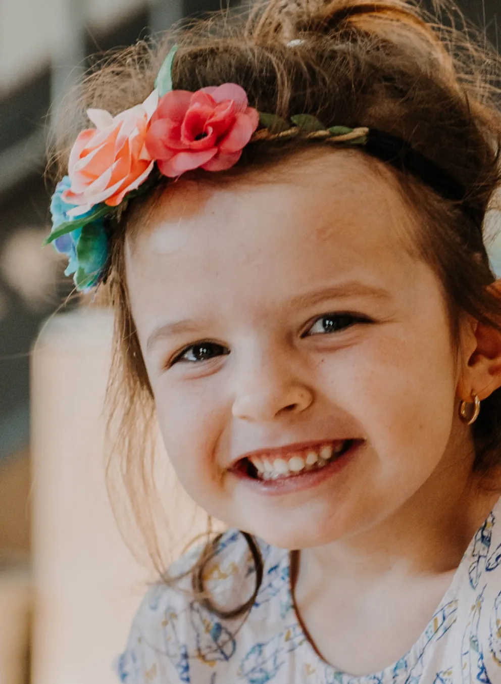 Young girl smiling in child care setting