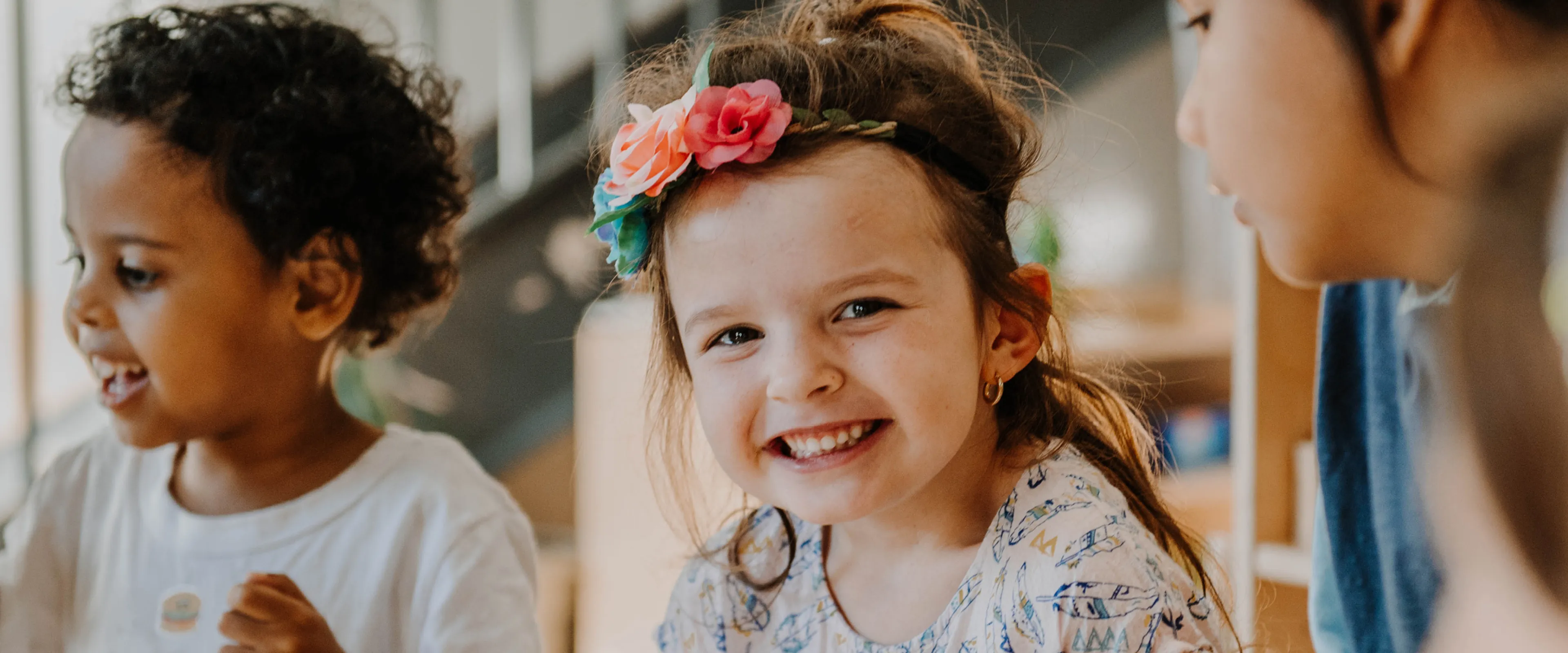 Young girl smiling in child care setting