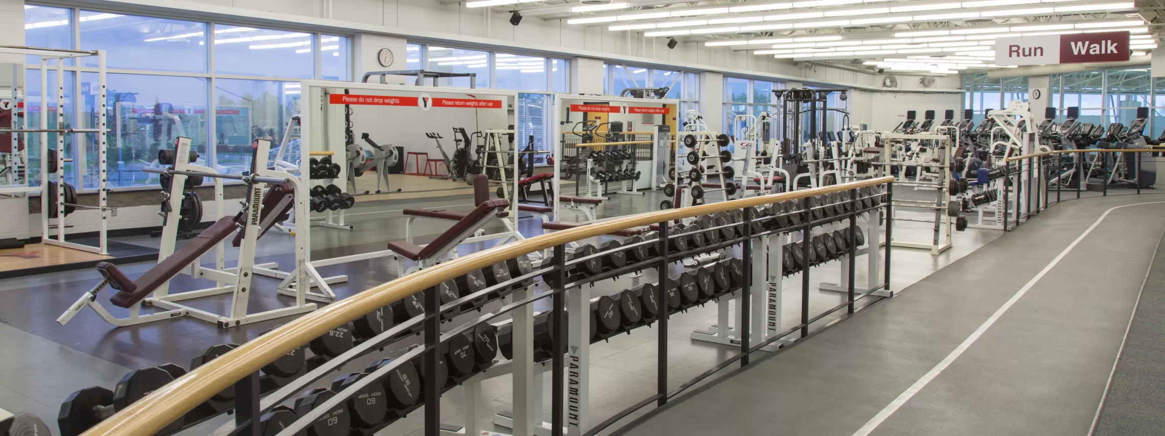 A fitness centre filled with various weight and cardio equiptment and an indoor track.